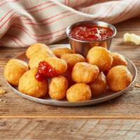 Fried White Cheddar Bites · Batter-fried white cheddar cheese pieces with marinara dipping sauce. Bite-sized gooey, chee...