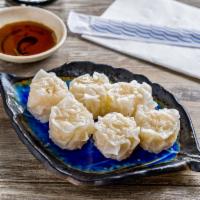 2. Shumai · 6 pieces steamed shrimp dumplings. Food may contain sesame seed.
