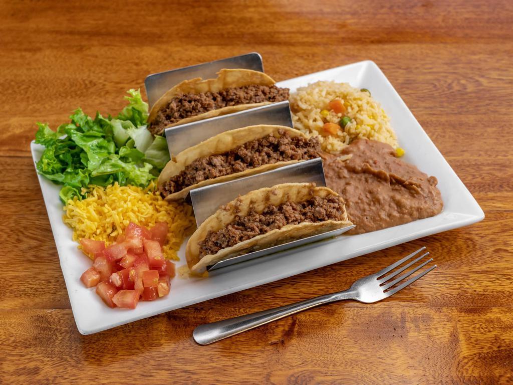 Crispy Tacos · 3 pieces. Corn tortillas, ground beef or shredded chicken, lettuce, tomatoes, cheese, served with rice and beans.