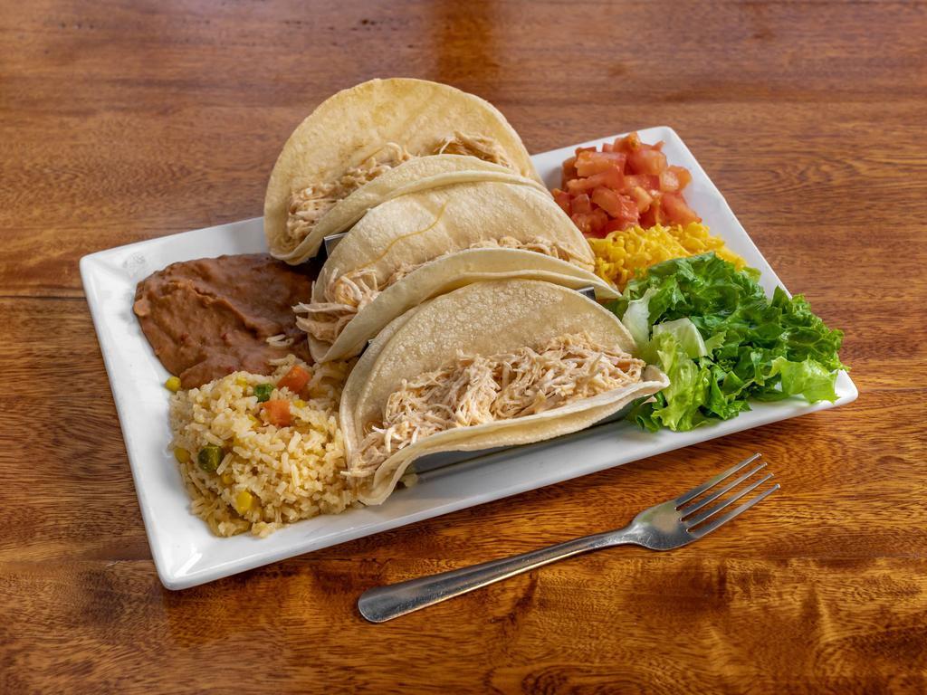 Soft Tacos · 3 pieces. Corn tortillas, ground beef or shredded chicken, lettuce, tomatoes, cheese, served with rice and beans.