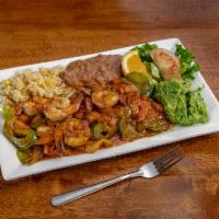 Camarones a la Diabla · Spicy grilled shrimp, rice, beans, salad, and guacamole.