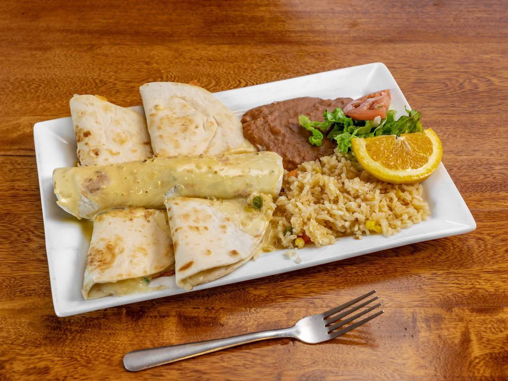 San Antonio Plate Combo · 2 chicken quesadillas, 1 rolled beef fajita taco topped with queso dip.