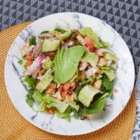 Asian Sesame Ginger Salad · Chicken or steak, tomatoes, cucumbers, red onions, sesame
seeds, craisins, avocado, and Asi...