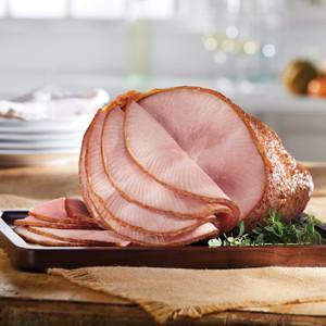 10-11 lb Bone-In Half Ham · Our Gold Standard - always moist and tender Bone-In Honey Baked Ham, smoked for up to 24 hours with our special blend of hardwood chips then hand-crafted with our sweet & crunchy glaze. We've been told time and time again that we have the World's Best Ham. Spiral sliced, fully-cooked and ready to serve for convenience. Serves 15 or more.