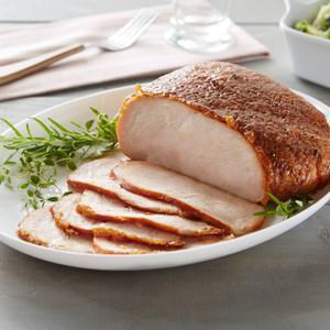 Roasted Turkey Breast · Premium 100% white breast meat and hand-crafted in store with our sweet crunchy glaze. Fully cooked, pre-sliced and ready to serve. Serves 6-8 / Weight 2.5-3 lb.