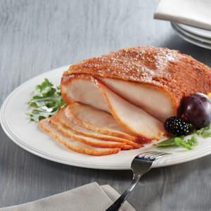 Smoked Turkey Breast · Premium 100% white breast meat and hand-crafted in store with our sweet crunchy glaze. Fully cooked, pre-sliced and ready to serve. Serves 6-8 / Weight 2.5-3 lb.