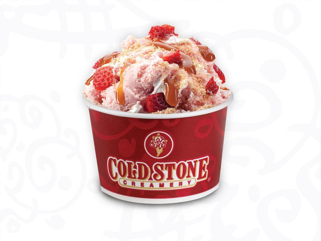 Our Strawberry Blonde · Strawberry ice cream with graham cracker pie crust, strawberries, caramel and whipped topping.