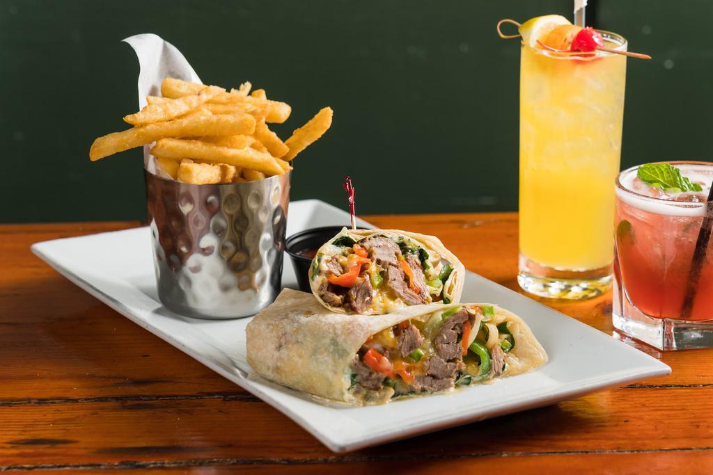 Southwestern Steak Wrap · Steak, Cheddar and Jack Cheese, Corn, Peppers, Onions, Field Greens, Spicy Mayo