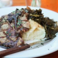 Grilled Pork Chops · Garlic Mashed Potato, Onion Gravy, Collard Greens