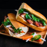 Grilled Chicken Banh Mi · Vietnamese baguette, grilled lemongrass chicken, pork pate, mayo, cucumber, pickled carrots ...