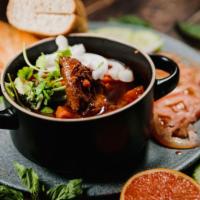 Beef Stew Banh Mi · Dip style! Beef stew topped with green and white onions and cilantro. Vietnamese baguette, m...