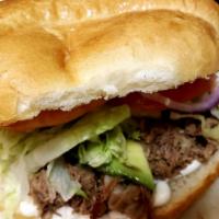 Carnitas Torta · Homemade carnitas!! Like no others!! Iceberg lettuce ,tomatoes, red onions and hot sauces on...