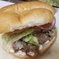 Barbacoa Torta · Slow steam cooked beef whit lettuce, tomatoes, red onion  mayo and mustard. Hot sauces onside