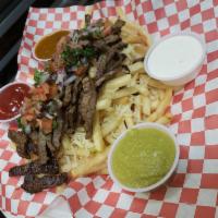 Carne Asada Fries · Bed of crinkle cut fries whit Monterrey cheese topped with carne asada or your choice of mea...