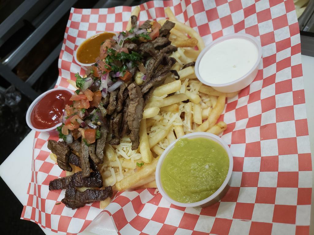 Carne Asada Fries · Bed of crinkle cut fries whit Monterrey cheese topped with carne asada or your choice of meat, sour cream, pico de gallo and hot sauces onside