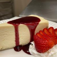 Cheesecake  · 8oz slice traditional cheesecake, topped whit raspberry sauce and strawberry 