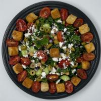 Kale Ceaser Salad · Kale, Green olives, Red onion, Cucumber, Cherry tomatoes, Garbanzo, Feta cheese, Croutons, O...