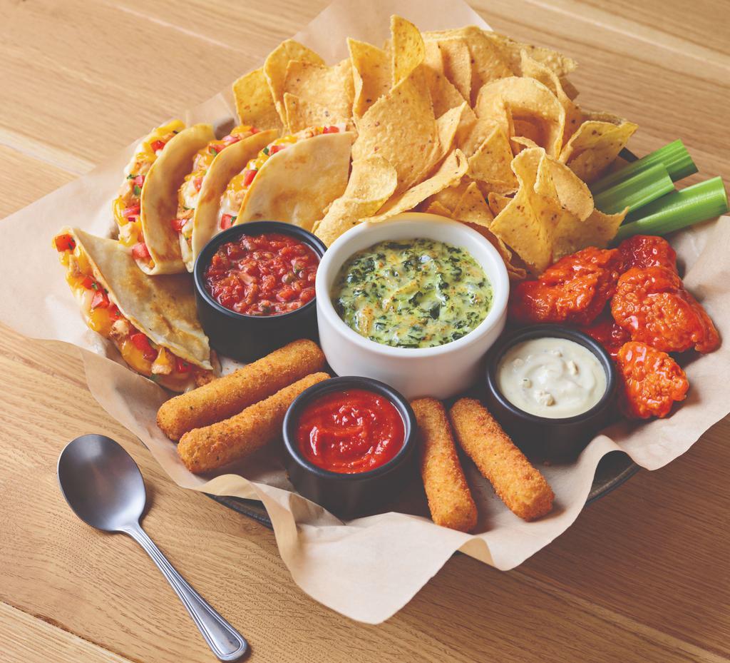 The Classic Combo · All the classic apps you love on one plate: boneless wings, spinach and artichoke dip, chicken quesadilla and mozzarella sticks.