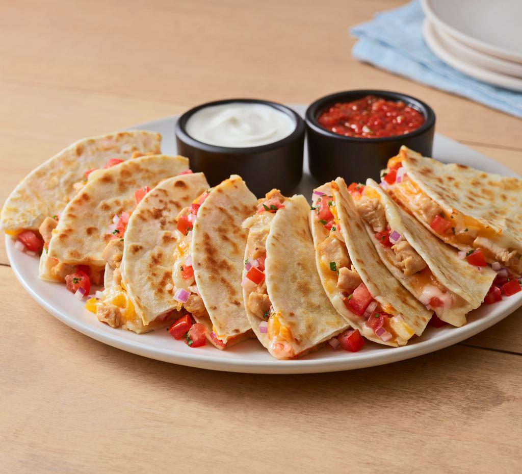 Chipotle Lime Chicken Quesadilla · Chipotle lime chicken, fresh pico, and a blend of melted cheddar cheese. Served with green chile sauce and out chipotle lime salsa.