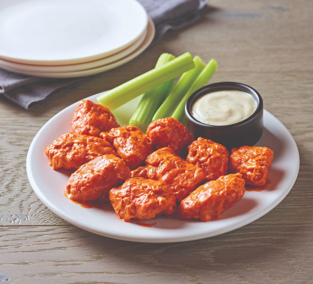 Boneless Wings · Crispy breaded pieces of tender boneless chicken tossed in your choice of sauce. Served with bleu cheese or ranch dressing.