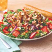 Strawberry Balsamic Chicken Salad · Tart, fresh and flavorful, mixed greens are tossed in a sweet lemon olive oil vinaigrette wi...