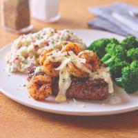 Shrimp 'N Parmesan Sirloin · Grilled 8 oz. USDA Select top sirloin and is topped with sautéed blackened shrimp and our cr...