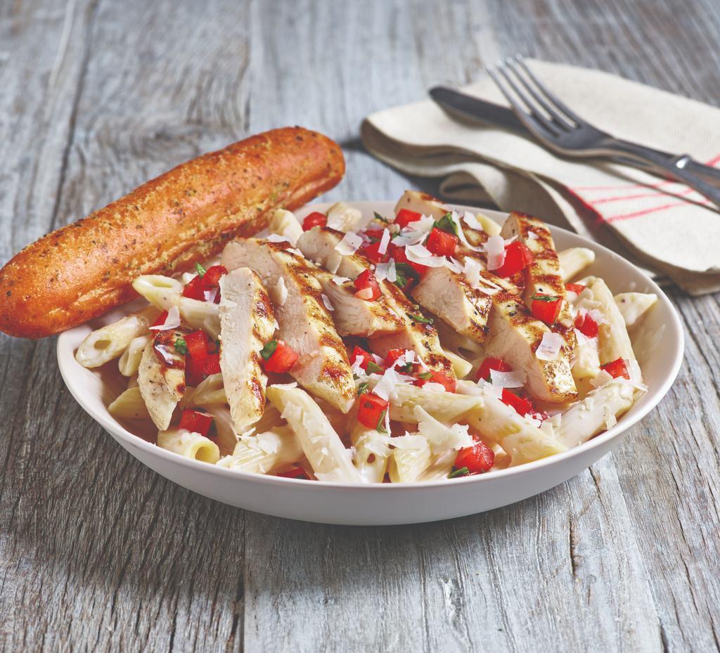 3-Cheese Chicken Penne · Asiago, Parmesan and white cheddar cheeses are mixed with penne pasta in a rich Parmesan cream sauce, then topped with grilled chicken breast and bruschetta tomatoes. Served with a golden brown signature breadstick brushed with garlic and parsley butter.