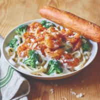 Blackened Shrimp Alfredo · Blackened Shrimp is served warm on a bed of fettuccine pasta tossed with broccoli and rich A...