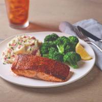 Blackened Cajun Salmon · 6 oz. blackened salmon fillet grilled to perfection. Served with your choice of two sides. G...
