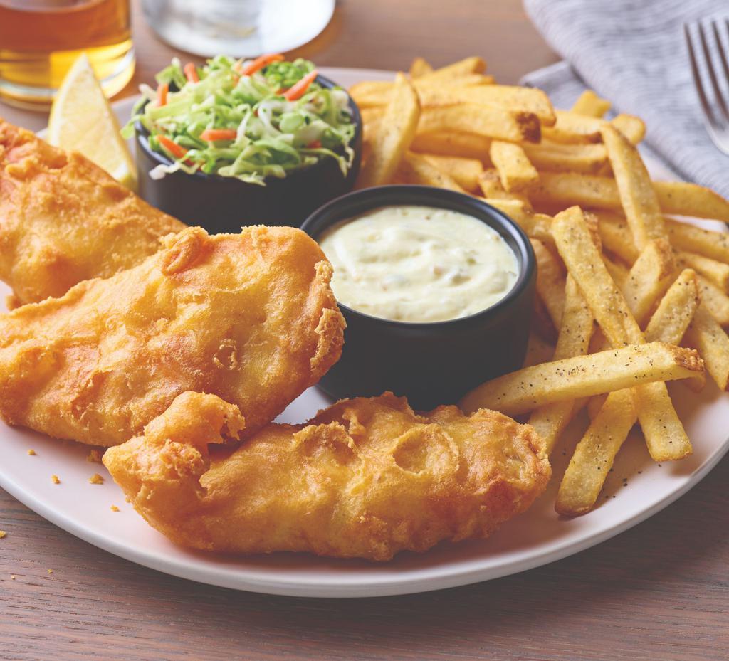 Hand-Battered Fish and Chips · Golden, crispy-battered fish fillet with fries. Served with our signature coleslaw, tartar sauce and a lemon wedge.