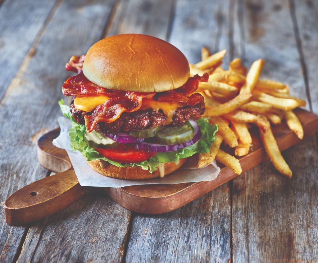 Classic Bacon Cheeseburger · Our juicy all-beef patty topped with two slices of American cheese and two strips of Applewood-smoked bacon. Served with lettuce, tomato, onion and pickles on a Brioche bun.
