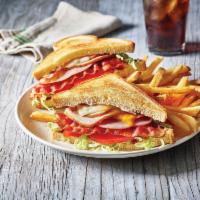Clubhouse Grille · Turkey, ham, bacon, cheddar and Jack, honey BBQ, lettuce, tomato and mayo served on potato b...