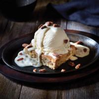 Butter Pecan Blondie · Baked with nuts, topped with ice cream, glazed pecans & maple-flavored cream cheese sauce. S...