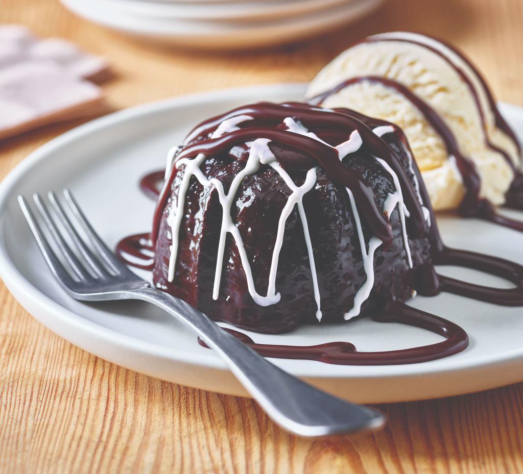 Triple Chocolate Meltdown · Warm, rich, fudge-filled chocolate cake is drizzled with hot fudge. Served with vanilla ice cream.