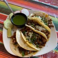 Tacos de alpastor  · Marinated pork with pineapple. Everyone’s favorite!!  served with cilantro and onions on the...