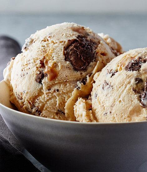 Caramel Cone Ice Cream · We balance a creamy blend of caramel ice cream and rich caramel swirls with the sweet crunch of chocolaty cone pieces to create a sweet, harmonious bite. 

