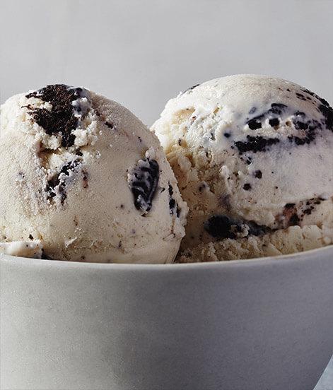 Cookies and Cream Ice Cream · Pieces of rich, chocolaty cookies are dunked in delicious, creamy vanilla ice cream to satisfy the milk-and-cookies kid in all of us. 

