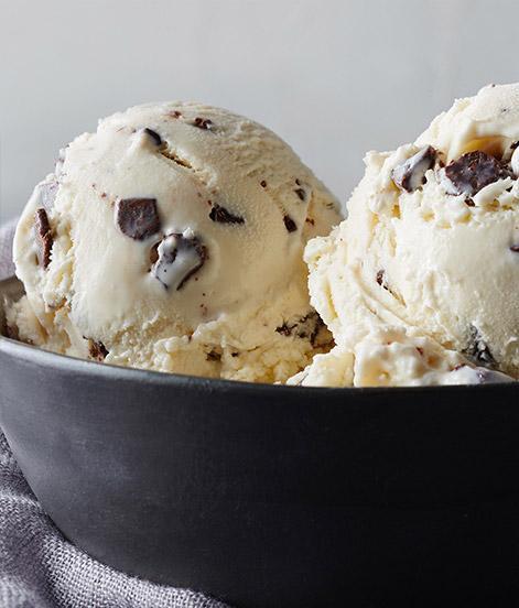 Vanilla Chocolate Chip Ice Cream - Regular · Our delectable chocolate chips are swirled with our creamy, smooth vanilla ice cream, allowing two flavor titans to come together in this classically indulgent treat.
