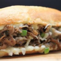 Cheese Steak Sub · Slices of beef, bell peppers, white onions, mayonnaise sauce and mozzarella cheese.