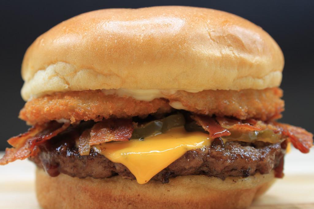 Western Burger · Burger patty, cheese, bacon, onion rings, pickles, BBQ sauce, mayonnaise and mustard