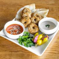 Falafel Plate · Comes with harissa sauce, tahini sauce, sliced pita bread, pickles, and peppers. Each item c...