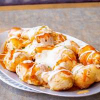 Buffalo Garlic Knots · A classic snack, our garlic knots are strips of pizza dough tied in a knot, baked, and then ...
