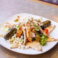Chicken Greek Salad · Tomatoes, cucumbers, onions, olives, and feta cheese in an olive oil dressing.