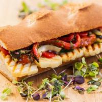 Nicosia Sandwich · Grilled halloumi with roasted peppers, olives, cornichon and cucumber salad.