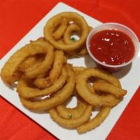 Onions Rings · Battered onions rings served with ketchup.
