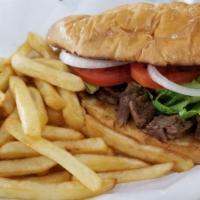 #55. Beef Torta and Fries · Toasted French bun, sour cream, guacamole, lettuce, tomatoes, onions served with fries.