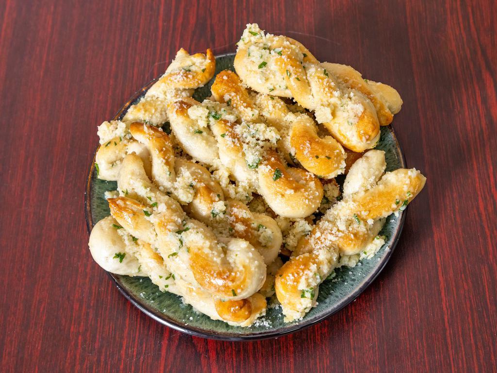 Garlic Twists · 3 pieces. Served with tomato sauce.