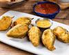 Firecracker Stuffed Jalapeños · Handmade, tempura-fried jalapeños filled with mixed cheese and chicken. Served with our signature queso.