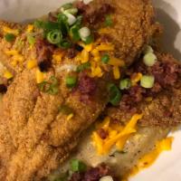 Darla’s Catfish ＆ Grits · Egg, Bacon and Green Onion Grit Cake, topped with Fried Catfish, Red and Green Peppers, Ando...