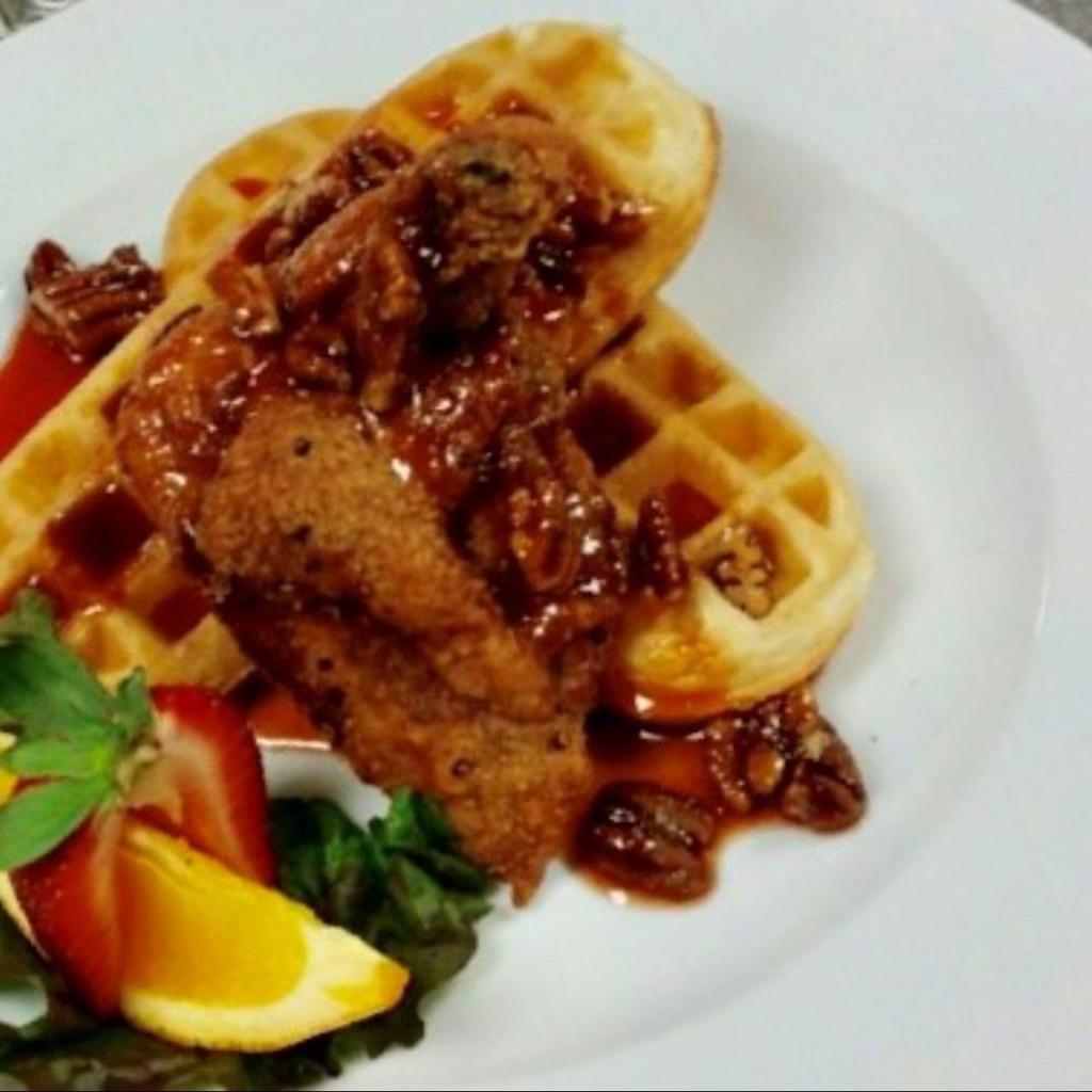 Chicken ＆ Waffle · Cajun 2 pcs. Fried Chicken with Belgium style Waffle Boat and Bacon Maple Syrup and Brown Sugar and Cinnamon Butter.